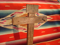 Mexican vintage devotional art, and Mexican vintage wood-carving, a mesquite cross with one nail remaining, c. 1890-1900.  Closeup photo.