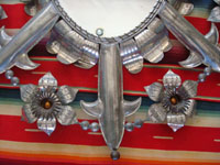 Mexican vintage tinwork-art, or tin-art, a very fine tinwork mirror with excellent construction and stamping, c. 1940-50's. Closeup photo of tin mirror.