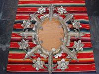 Mexican vintage tinwork-art, or tin-art, a very fine tinwork mirror with excellent construction and stamping, c. 1940-50's. Photo showing the back side of the mirror.
