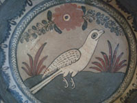 Mexican vintage pottery and ceramics, a lovely burnished pottery plate with graceful and magnificent artwork, Tonala or San Pedro Tlaquepaque, c. 1930's. Closeup photo of the bird on the front of the plate.