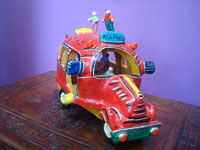 Mexican vintage folk art, a wonderful pottery red bus with eight delightful passengers, including the driver, happily traveling to the beach city of Acapulco, attributed to the great Candelario Medrano, Santa Cruz de las Huertas, Jalisco, c. 1950's. Main photo of the bus.