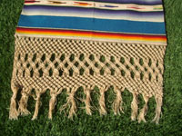 Mexican vintage textiles and Saltillo-style serapes (sarapes), a magnificent Saltillo-style serape runner, very finely woven and with lovely teneriffe (lacework) between the colorful bands of the textile, c. 1940's.  Closeup photo of the fringe at one end of the serapa.