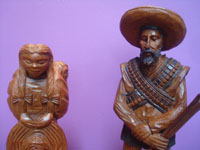 Mexican vintage woodcarvings and masks, a lovely woodcarving depicting a rvolutionary couple, Mexico, c. 1940's. Closeup photo of the couple.
