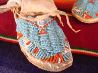 Native American Indian beadwork baby mocassins, Lakota or Cheyenne, c. 1890-1900. The beadwork is fantastic and is in great condition. A closeup of the beadwork on one of the mocassins.