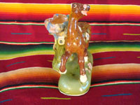 Mexican vintage pottery and ceramics, a prancing horse with attached bowl, Tlaquepaque, c. 1930. A photo from the front of the horse.