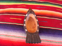 Native American Indian wood-carving and folk art, a Northwest Coast carved grease-bowl in the form of a raven, c. 1910-20. The raven bowl is beautifully carved and is wonderfully inlaid with pieces of abalone shell. Photo from above the bowl, showing the inside.