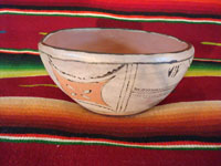 Native American Indian antique pottery, a chili bowl from Santa Ana Pueblo in New Mexico, c. 1910-20. The painted decorations on the bowl have faded with time, but are still incredibly beautiful. Main photo.