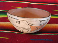 Native American Indian antique pottery, a chili bowl from Santa Ana Pueblo in New Mexico, c. 1910-20. The painted decorations on the bowl have faded with time, but are still incredibly beautiful. Another view of bowl.