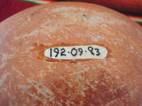 Native American Indian antique pottery, a chili bowl from Santa Ana Pueblo in New Mexico, c. 1910-20. The painted decorations on the bowl have faded with time, but are still incredibly beautiful. A closeup photo of the museum number on the bottom of the Santa Ana Pueblo bowl.