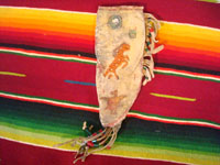 Native American Indian beadwork and folk art, a Plains knife-sheath with ghost-dance designs and symbolism, c. 1890-1910. The sheath is sinew sown with brain-tanned leather, and with fringe and bottom-tassles with beads. Main photo.