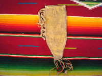 Native American Indian beadwork and folk art, a Plains knife-sheath with ghost-dance designs and symbolism, c. 1890-1910. The sheath is sinew sown with brain-tanned leather, and with fringe and bottom-tassles with beads. Photo showing the back side of the sheath.