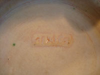 Mexican vintage pottery and ceramics, a large charger from Tlaquepaque, Jalisco, c. 1920-30. Closeup of the mark stamped on the bottom of the charger.