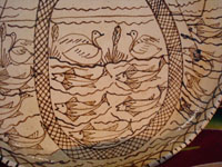 Mexican pottery and ceramics, a wonderful charger from Tzintzuntzan, Michoacan, on the shores of Lake Patzcuaro, c. 1990. Closeup showing the ducks and fish under the boat.