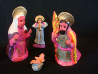Mexican vintage folk art, and Mexican vintage devotional art, a beautiful and brightly decorated pottery nativity set, Metepec, c. 1940's. Photo showing the Holy Family, part of the nativity set from Metepec.
