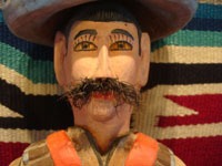 Mexican vintage folk art, and Mexican vintage woodcarvings and masks, a woodcarving depicting the hero of the Mexican revolution, Emiliano Zapata, by the famous folk artist Manuel Jimenez of Arrazola, Oaxaca, c. 1950's. Closeup photo of Zapata's face with his famous mustache.