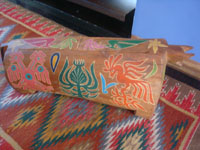 Vintage South American folk art, a carved and decorated slit wooden drum with drumsticks, the Rainforest of Souh America, c. 1950's. Photo of the second side of the drum.