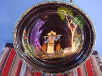 Mexican vintage pottery and ceramics a beautiful blackware plate of a scene of a paisano coming from the well with full jarros (jars) of water. Main image of the plate.