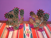 Mexican tinwork art, tin Oaxacan candle holders, Oaxaca, c. 1990. Main photo of the candle holders.