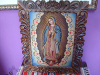 Mexican fine art, an oil painting of Our Lady of Guadalupe in a very fine wood carved frame from 1930, the painting is from c. 1950. Main photo of the piece.