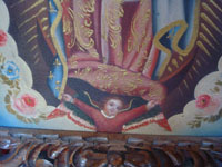 Mexican fine art, an oil painting of Our Lady of Guadalupe in a very fine wood carved frame from 1930, the painting is from c. 1950. Closeup photo of the angel at Our Lady's feet.
