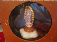 Mexican vintage devotional art and folk art, a wonderful wooden nicho, used to display an image of Christ, the Blessed Virgin, or a saint, c. 1940's. Closeup photo showing the statue of Our Lady of Guadalupe inside of the nicho.