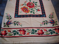 Mexican vintage sarapes and textiles, a lovely weaving from Oaxaca, c. 1910-20. The textile features lovely roses; it is an incredible piece of art. Closeup photo.
