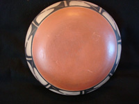 Native American Indian pottery and ceramics, a medium/large dough bowl from Santo Domingo Pueblo, c. 1970-80. The designs painted on the bowl are very beautiful and feature wonderful birds and foliage. Photo of the back side of the Native American Indian pottery bowl.