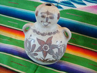 Mexican vintage folk art, and Mexican vintage pottery and ceramics, a pottery figure of a seated person, with wonderful hand-painted decorations in the style of the state of Guerrero, Tulimon, Guerrero, c. 1970. Main photo of the Guerrero figure.
