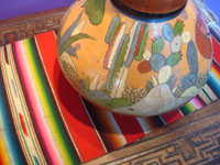 Mexican vintage pottery and ceramics, a lovely pottery water jar with a drinking cup on the top, Tonala or San Pedro Tlaquepaque, c. 1940. Closeup photo of some of the cacti.