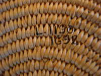 Closeup photo of museum mark on bottom of Chemehuevi olla.