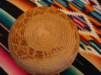 Photo of the bottom of the Mission Indian basket with the tail of the rattlesnake.