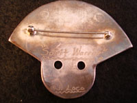 Photo of back of Navajo vintage silver pin depicting the Apache Spirit Warrior.
