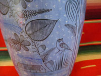 A closeup photo of the second side of the Tonala burnished vase.