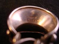 Closeup photo of the signature on the inside of the vintage Mexican silver earrings.