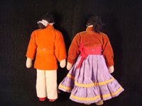 Photo of the backs of the Navajo folk art dolls.