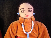 Closeup photo of the face of one of the Navajo folk art dolls.