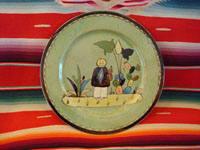 I-8: Mexican vintage pottery and ceramics, a Tlaquepaque pottery plate with pale green background and wonderful art-work, c. 1930. Size: 10" diameter. The hand-painted art-work on this plate is phenomenal! The plate has a wonderful squiggle border around the edge. Condition is excellent. Price: $130.