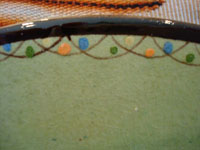 A closeup photo showing the border of the Mexican vintage pottery plate from Tlaquepaque, Jalisco, Mexico.