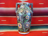 Mexican vintage pottery and ceramics, a pottery tourist jar with handles and fine floral decorations, 1940.