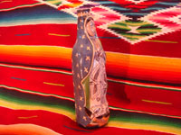 Mexican vintage pottery and ceramics, and Mexican vintage devotional art, a pottery bottle of Our Lady of Guadalupe from Tlaquepaque, c. 1930-40. Side view of bottle.