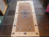 Mexican vintage textiles and sarapes, a lovely Texcoco runner, Texcoco, c. 1940's. The textile features beautiful natural wool colors with accents of indigo blue and cochineal red. Main photo.