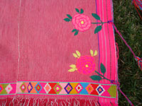 Mexican vintage clothing, and Mexican vintage textiles and huipiles, a vintage huipil of hand-woven cotton with very fine embroidery, Zinacantan, Chiapas, c. 1960's. Closeup photo of the embroidery on the vintage Mexican blouse or huipil.