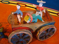 Mexican vintage folk art, and Mexican vintage pottery and ceramics, a wonderful pottery cart or carriage, pulled by two horses and filled with happy campesinos, attributed to the great folk artist, Candelario Medrano, Santa Cruz de las Huertas, Jalisco, c. 1940's.  Closeup photo of the happy passengers in the cart.