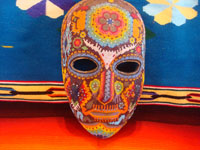CI-13: Mexican vintage woodcarvings and masks, a beautiful beaded Huichol mask with very intricate and crisp design elements, the Sierras of Nyarite, c. 1950's. Main photo of the Huichol beaded mask.