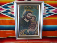 Mexican and New Mexican vintage devotional art, a New Mexican tin retablo painted with the images of St. Joseph and the Child Jesus, New Mexico, c. 1930's. Main photo of the New Mexican retablo.