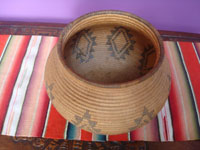 Native American Indian baskets, a beautiful Chemehuevi basketry olla with a tight weave and wonderful decorations, Arizona, c. 1920.  Photo shot from above and looking down at the basket.