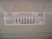 Photo of the 1949 calendar below the calendar-girl.