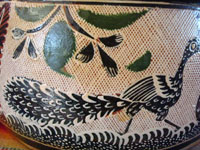 Closeup photo of one side of the petatillo Tlaquepaque pottery casserole with lid.