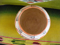 Native American Indian vintage pottery, an Acoma pot, c. 1960's. The pot is beautifully hand-painted with traditional Acoma geometric designs and is unsigned, indicating the age of the piece before artists began to regularly sign their pottery pieces. A photo showing the inside of the Acoma pot.
