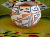 Native American Indian vintage pottery, an Acoma pot, c. 1960's. The pot is beautifully hand-painted with traditional Acoma geometric designs and is unsigned, indicating the age of the piece before artists began to regularly sign their pottery pieces.